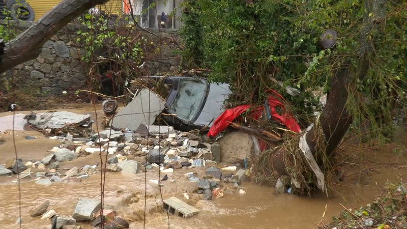 Still image taken from video shows town of Bitti affected by flash floods