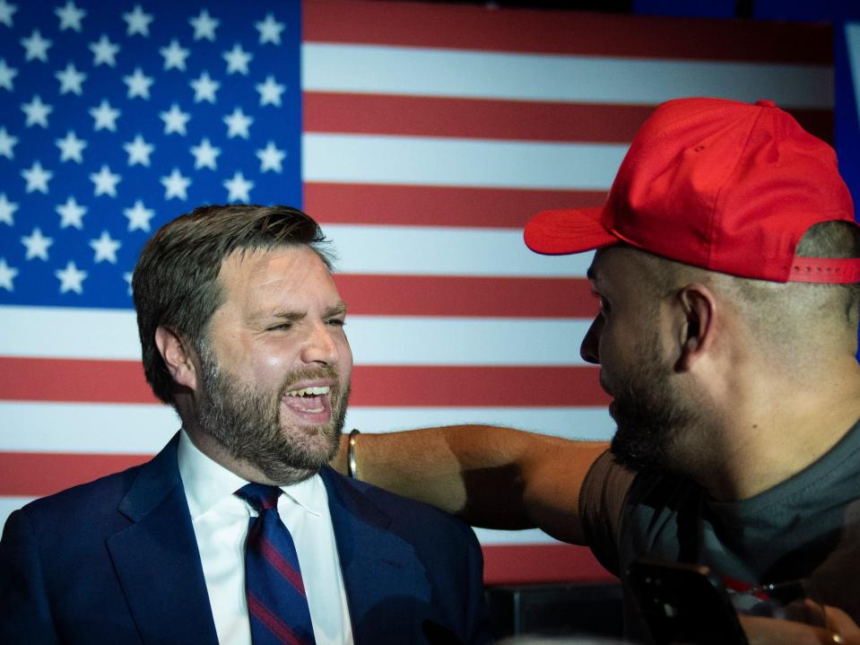 JD Vance greets a supporter after winning the primary