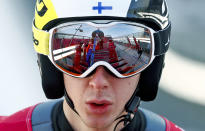 <p>Fellow jumpers are reflected in the goggles of Ilkka Herola, of Finland, during training for the men’s nordic combined competition at the 2018 Winter Olympics in Pyeongchang, South Korea, Tuesday, Feb. 13, 2018. (AP Photo/Matthias Schrader) </p>