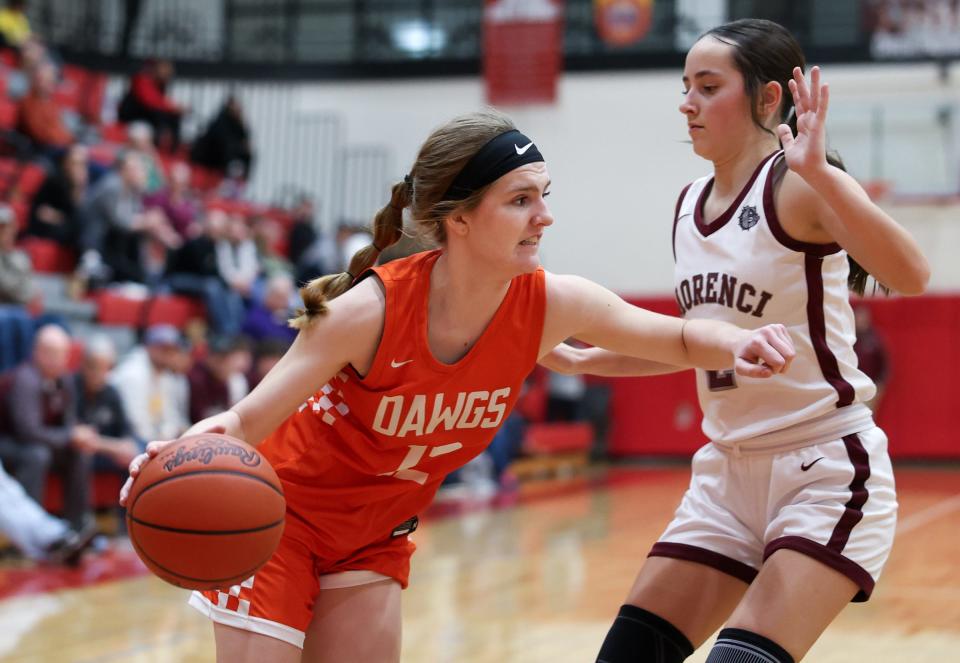 Summerfield's Mia Miller drives on Evelyn Joughin of Morenci during a 40-16 Morenci win in the semifinals of the Division 4 Regional at Whitmore Lake on Monday, March 11, 2024.