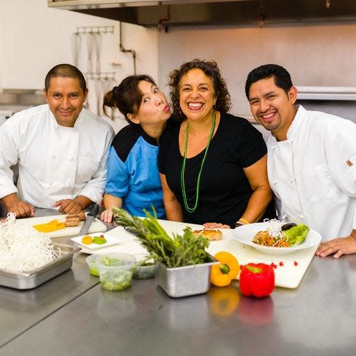 Doreen Alfaro kids around with her staff, from left, Antonio Garcias, NiNi Ha, Alfaro and Jose Xivir at Christafaro’s in this file photo.