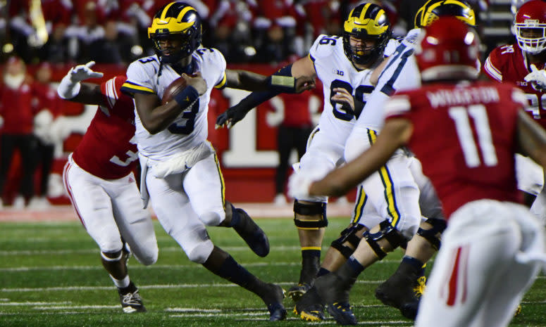 Michigan QB Joe Milton runs against Rutgers.