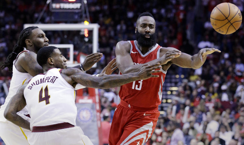 Houston Rockets guard James Harden (13) passes under pressure from Cleveland Cavaliers forward Jae Crowder (99) and guard Iman Shumpert (4) during the second half of an NBA basketball game Thursday, Nov. 9, 2017, in Houston. (AP Photo/Michael Wyke)