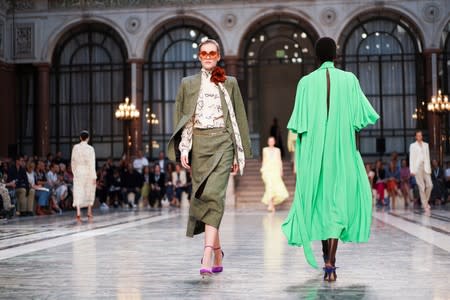 Models present creations during the Victoria Beckham catwalk show at London Fashion Week in London