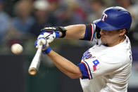 Texas Rangers' Corey Seager hits a home run against the Houston Astros during the third inning in Game 4 of the baseball American League Championship Series Thursday, Oct. 19, 2023, in Arlington, Texas. (AP Photo/Julio Cortez)