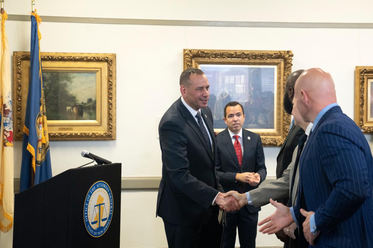 Sep 26, 2023; Paterson, NJ, USA; NJ Attorney General Matthew Platkin looks on as Paterson PD officer in charge Isa Abbassi greets attendees after he unveiled his strategic plan for city law enforcement at the Paterson Public Library. Mandatory Credit: Michael Karas-The Record