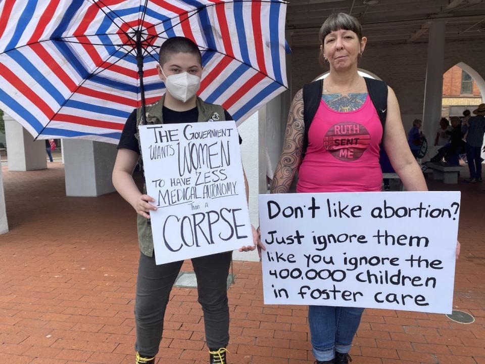 Protesters at the Fayetteville chapter of NOW protest in downtown Fayetteville.