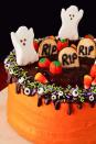 <p>Want to make a Halloween layer cake that you wouldn't be too scared to take a bite of? By topping it with Ghost Peeps, Milano cookies with the letters "RIP", and our favorite candies and sprinkles, the presentation is spooky, but will still lure everyone in for a bite.</p><p>Get the <strong><a href="https://www.delish.com/cooking/recipe-ideas/a23712647/halloween-layer-cake-recipe/" rel="nofollow noopener" target="_blank" data-ylk="slk:Halloween Layer Cake recipe;elm:context_link;itc:0;sec:content-canvas" class="link ">Halloween Layer Cake recipe</a></strong>.</p>