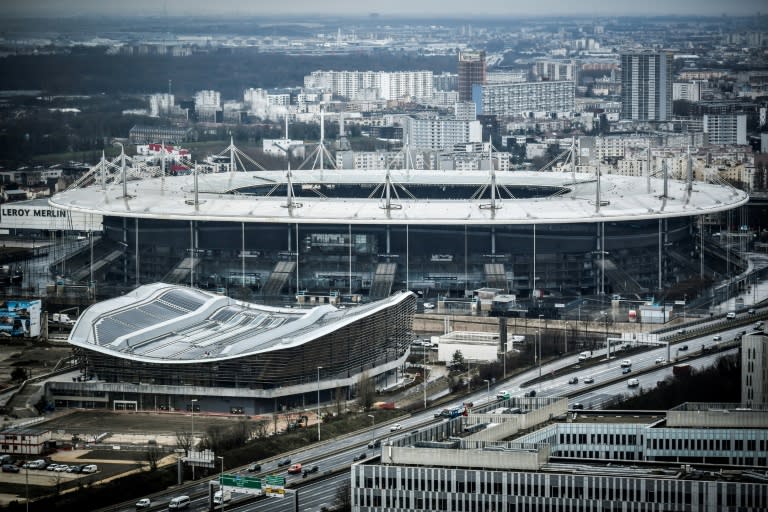 The Olympic Aquatics Centre (foreground), the renovated Stade de France and the footbridge that will join them have added to the bill for Paris (STEPHANE DE SAKUTIN)