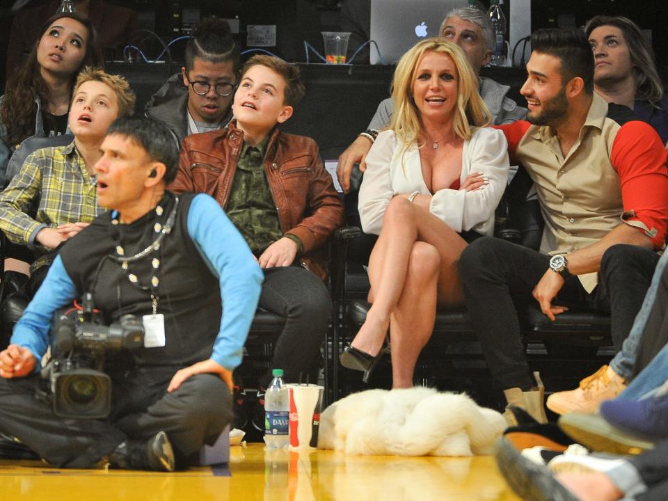 Sean Federline, Jayden Federline, Britney Spears and Sam Asghari attend a basketball game at Staples Center on November 29, 2017.