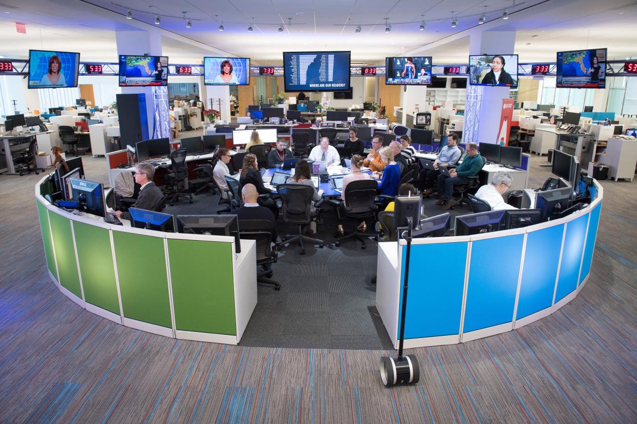 Staff gathers in the USA TODAY newsroom during a morning news meeting.