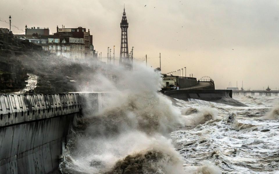 Waves break on the sea front in Blackpool during Storm Isha