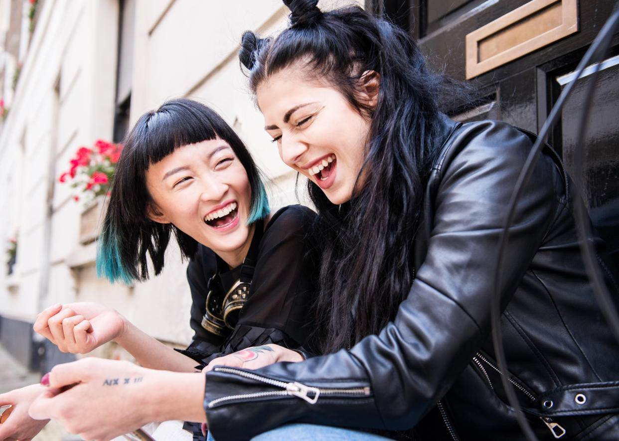 Two friends sharing laughter. (PHOTO: Getty Images)