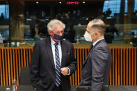 Luxembourg's Foreign Minister Jean Asselborn, left, talks to German's Foreign Minister Heiko Maas during a European Foreign Affairs Ministers meeting at the European Council building in Luxembourg, Monday, June 21, 2021. EU foreign ministers were set to approve Monday a new set of sanctions against scores of officials in Belarus and prepare a series of measures aimed at the country's economy. (Johanna Geron/Pool Photo via AP)