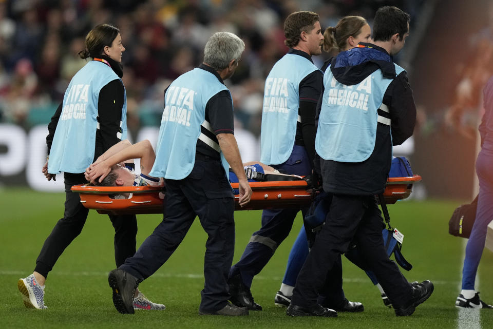 England's Keira Walsh reacts as she is stretchered-off after getting injured during the Women's World Cup Group D soccer match between England and Denmark at the Sydney Football Stadium in Sydney, Australia, Friday, July 28, 2023. (AP Photo/Rick Rycroft)