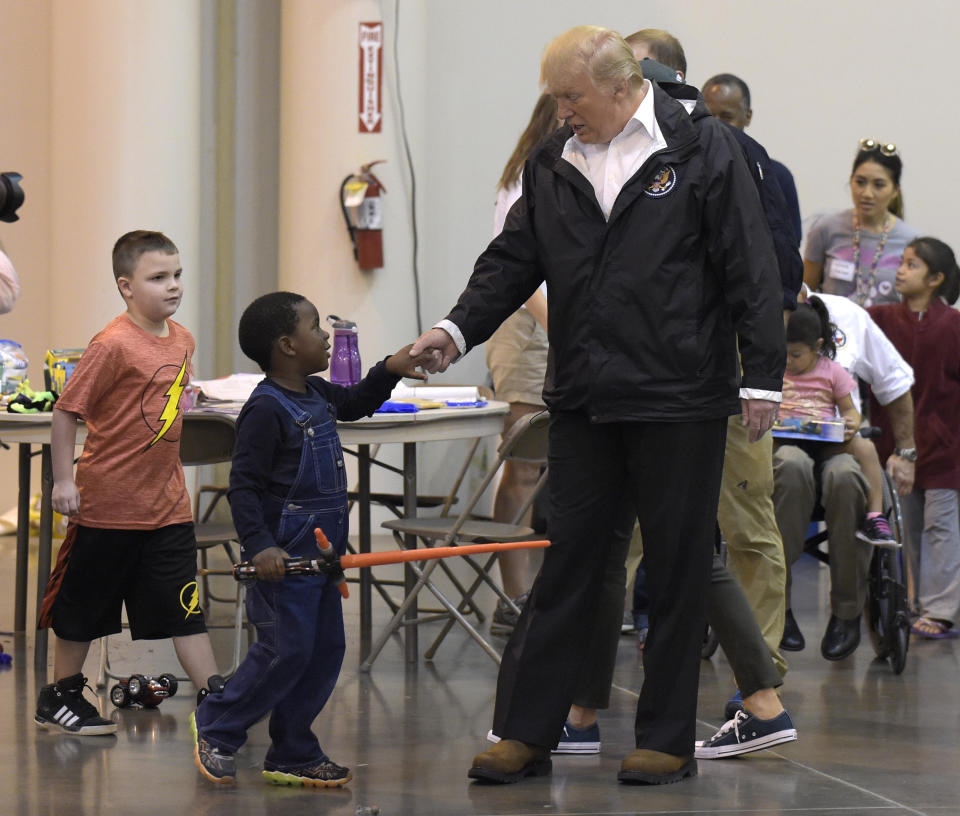 <p>President Donald Trump meets people impacted by Hurricane Harvey during a visit to the NRG Center in Houston, Saturday, Sept. 2, 2017. (Photo: Susan Walsh/AP) </p>