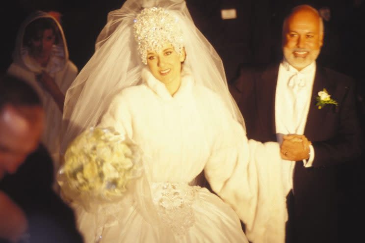 The iconic singer married her manager Rene Angélil in 1994 wearing a dramatic Mirella and Steve Gentile gown featuring long sleeves and a 20-foot train, topped off with a glittering seven-pound headpiece. [Photo: Getty/Ponopresse]