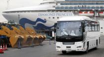 A driver wearing protective suits is seen inside a bus which believed to carry elderly passengers of the cruise ship Diamond Princess, where dozens of passengers were tested positive for coronavirus, in Yokohama