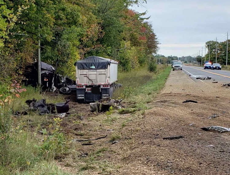 This Monday, Sept. 30, 2019 photo, released by the Ontario Provincial Police, shows the aftermath of a fatal crash involving a car and a transport truck near Shelburne, Ontario. Canadian police say the Jamaican dancehall reggae artist and actor known as Louie Rankin died in the car crash involving a transport truck. (Ontario Provincial Police/The Canadian Press via AP)