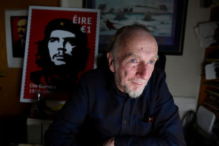 Artist Jim Fitzpatrick who has created an Irish postage stamp using the poster of Che Guevara he created in 1968 entitled 'Viva Che!' based on a photograph by Alberto Korda poses for a picture at his studio in Dublin, Ireland October 11, 2017. REUTERS/Clodagh Kilcoyne