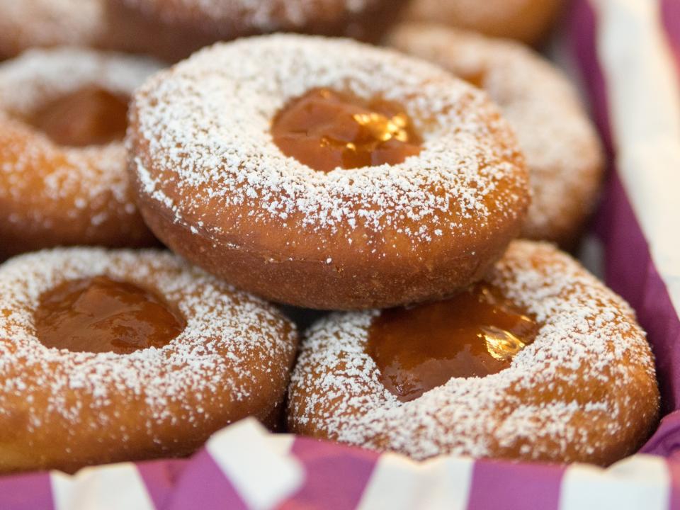 Doughnuts on a pink-and-white-striped tablecloth