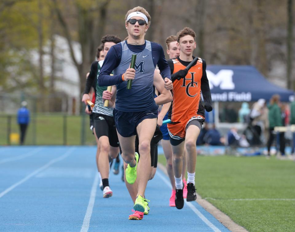 McDowell High School's Christian Mattern leads the first lap of the boys 3,200-meter relay race during Joe Sanford's McDowell Track and Field Invitational at McDowell High School in Millcreek Township on April 28.