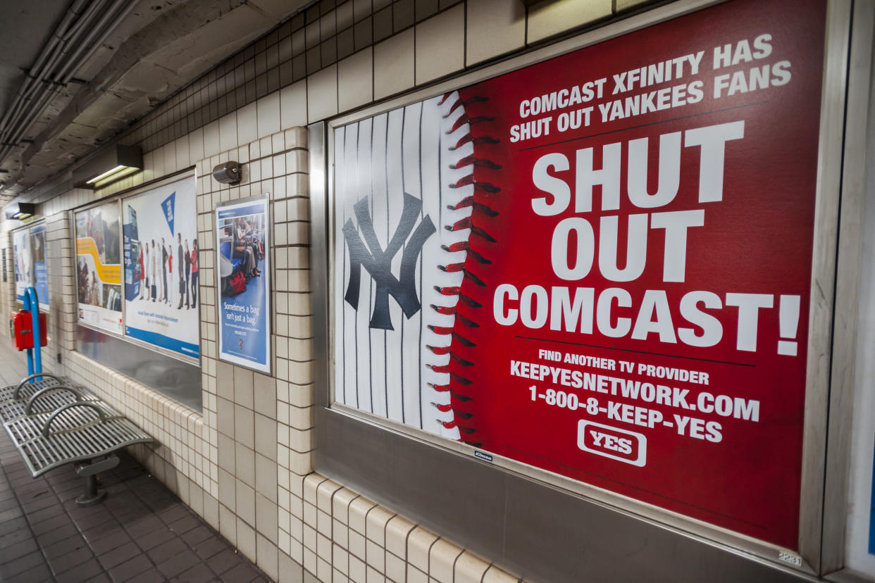 An advertisement by the YES Network in a PATH station in New York on Friday, March 11, 2016 urges viewers to dump Comcast as their cable television provider. The Yankees Entertainment and Sports (YES) network is embroiled in a dispute with cable provider Comcast after Comcast dumped them from their line up in a dispute over viewership. (�� Richard B. Levine) (Photo by Richard Levine/Corbis via Getty Images)