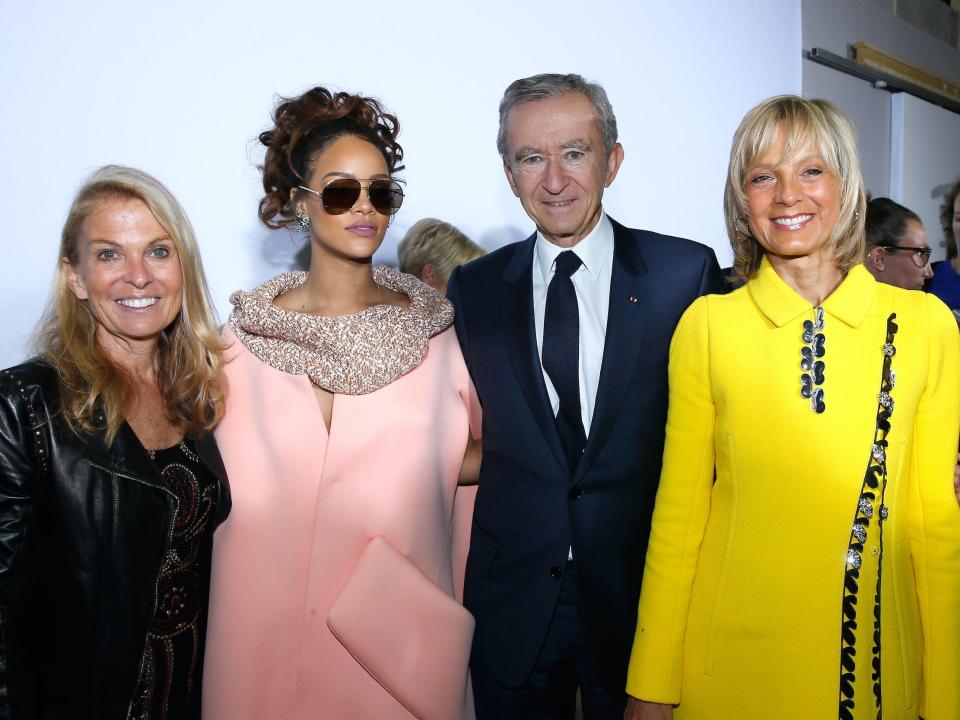 Rihanna poses with LVMH CEO Bernard Arnault, his wife, and the US ambassador to France