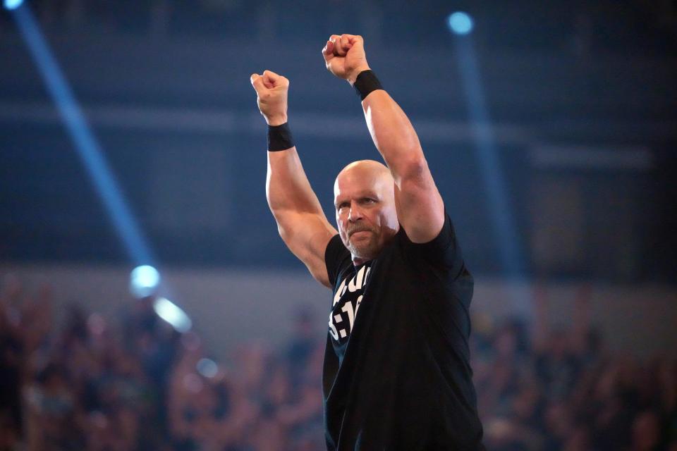 WWE Hall of Famer "Stone Cold" Steve Austin makes his entrance on April 2, 2022, in Arlington, Texas.
