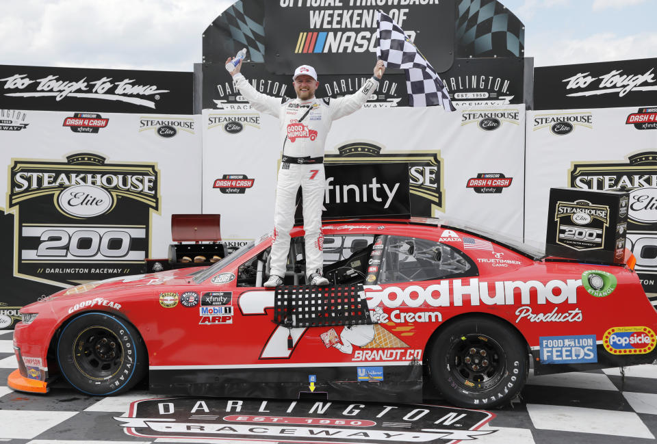 Justin Allgaier celebrates in Victory Lane after winning the NASCAR Xfinity Series auto race at Darlington Raceway, Saturday, May 8, 2021, in Darlington, S.C. (AP Photo/Terry Renna)