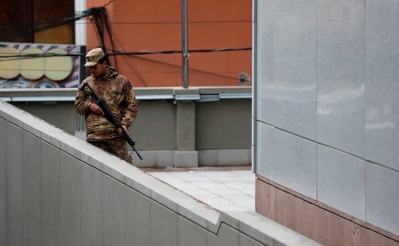 Member of the military stands guard at the presidential palace, after Bolivia's former president Evo Morales left the country, in La Paz