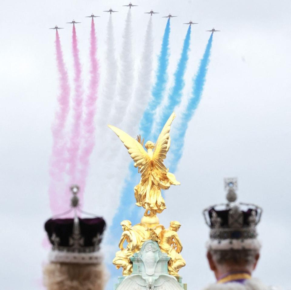 The King and Queen watch the flypast from the Buckingham Palace balcony after the Coronation - CHRIS JACKSON