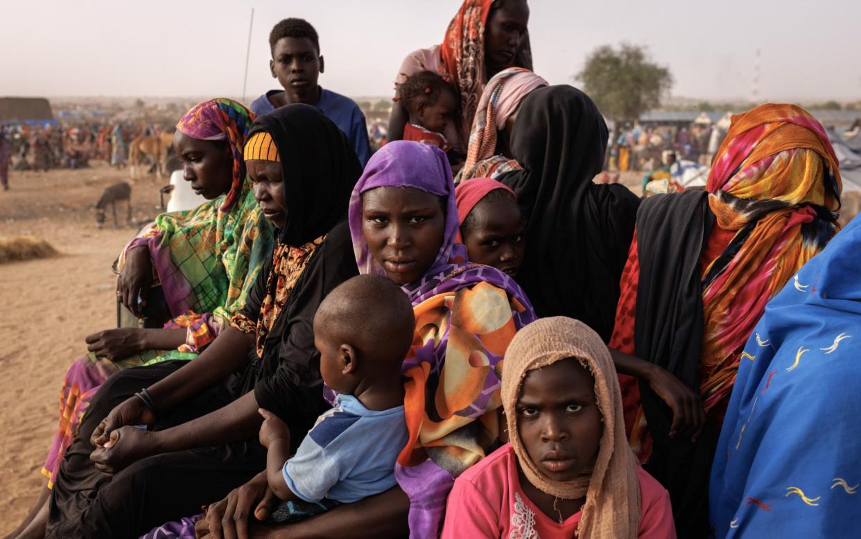 Newly arrived refugees from Darfur wait to be taken to a camp in Chad. Up to 11 million have been forced to flee their homes