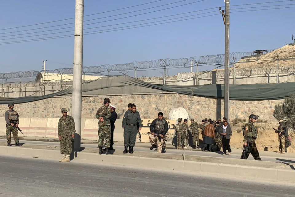 Afghan security personnel arrive at the site of explosions in front of the Kabul Military Training Center in Kabul, Afghanistan, Monday, Nov. 18, 2019. Back-to-back explosions early Monday targeting the military training center wounded Afghan national army soldiers, police and interior spokesmen said. (AP Photo/Rahmat Gul)