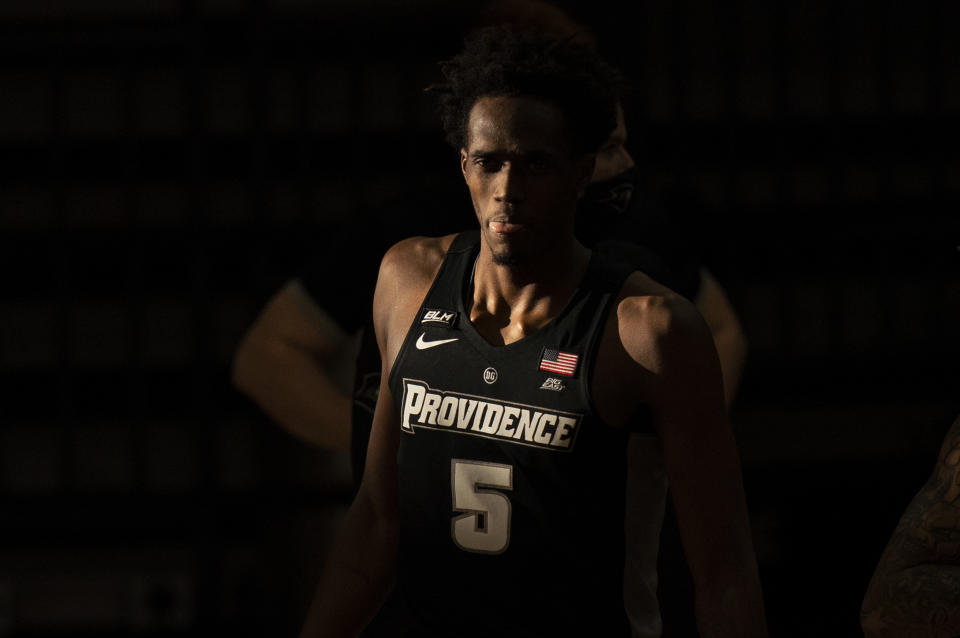 Providence's Jimmy Nichols Jr. looks on as a stream of sunlight delays the start of the second half of an NCAA college basketball game Saturday, Jan. 23, 2021, in Villanova, Pa. Villanova won 71-56. (AP Photo/Chris Szagola)