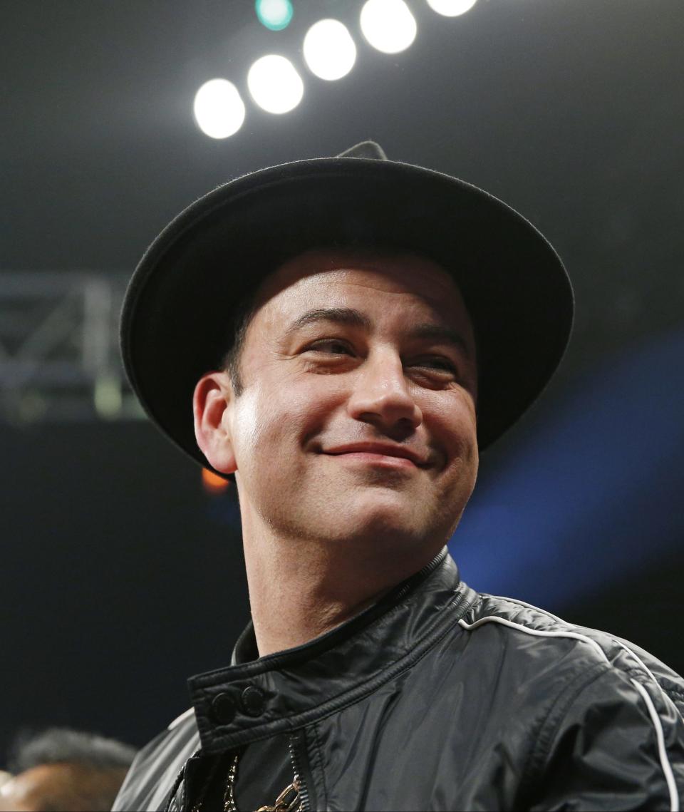 Comedian Jimmy Kimmel joins the crowd before the start of the world welterweight championship bout between Floyd Mayweather Jr., and Manny Pacquiao, on Saturday, May 2, 2015 in Las Vegas. (AP Photo/John Locher)