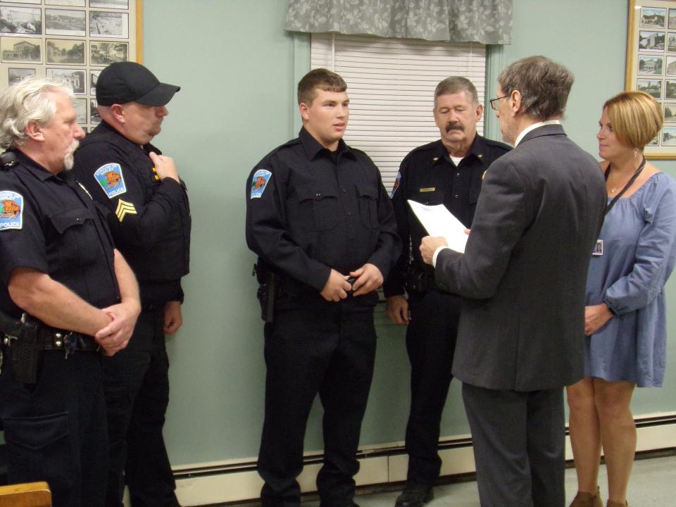 Hawley Borough Patrolman Zachary Mead was welcomed to the police force at the Oct. 13, 2023, council meeting. From left are officer Lee Rowan; Sgt. Aaron Bertholf; Mead; Chief Daniel Drake; Mayor John Nichols and Becky Mead, Officer Mead's mother and a borough council member.