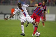 Serey Die of Basel (L) chellenges Mihai Pintilii of Steaua Bucharest (R) during their Champions League soccer match at the National Arena in Bucharest October 22, 2013. REUTERS/Bogdan Cristel (ROMANIA - Tags: SPORT SOCCER)
