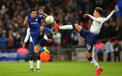Pedro of Chelsea and Dele Alli of Tottenham Hotspur challenge for the ball during the Carabao Cup semi-final first leg - Credit: GETTY IMAGES