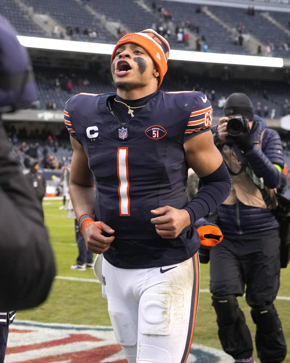 Chicago Bears quarterback Justin Fields heads to the locker room and celebrates towards the fans after the team's 28-13 win over the Detroit Lions in an NFL football game Sunday, Dec. 10, 2023, in Chicago. (AP Photo/Nam Y. Huh)