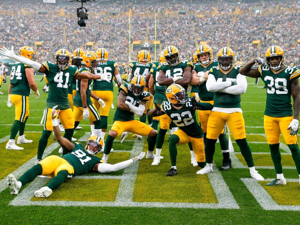 The Packers defense celebrates a fumble recovery against the Pittsburgh Steelers.