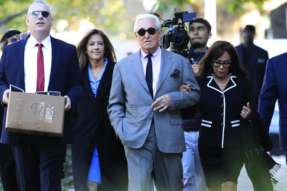 Roger Stone, with his wife, Nydia Stone, right, arrive at the federal court in Washington, Tuesday, Nov. 5, 2019. Stone, a longtime Republican provocateur and former confidant of President Donald Trump, goes on trial over charges related to his alleged efforts to exploit the Russian-hacked Hillary Clinton emails for political gain. (AP Photo/Manuel Balce Ceneta)