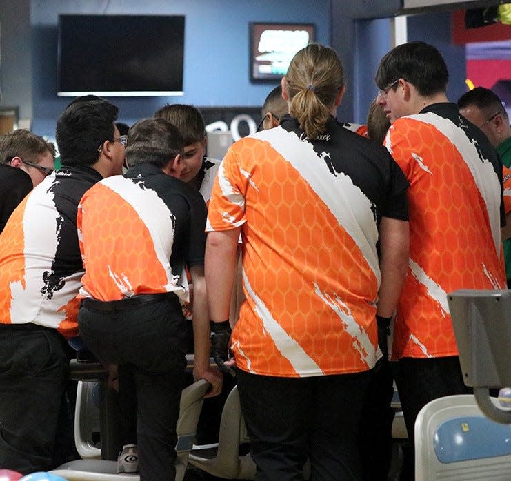 Members of the Artesia High School bowling team discuss plans during the Bulldog Invitational on Jan. 20, 2024.