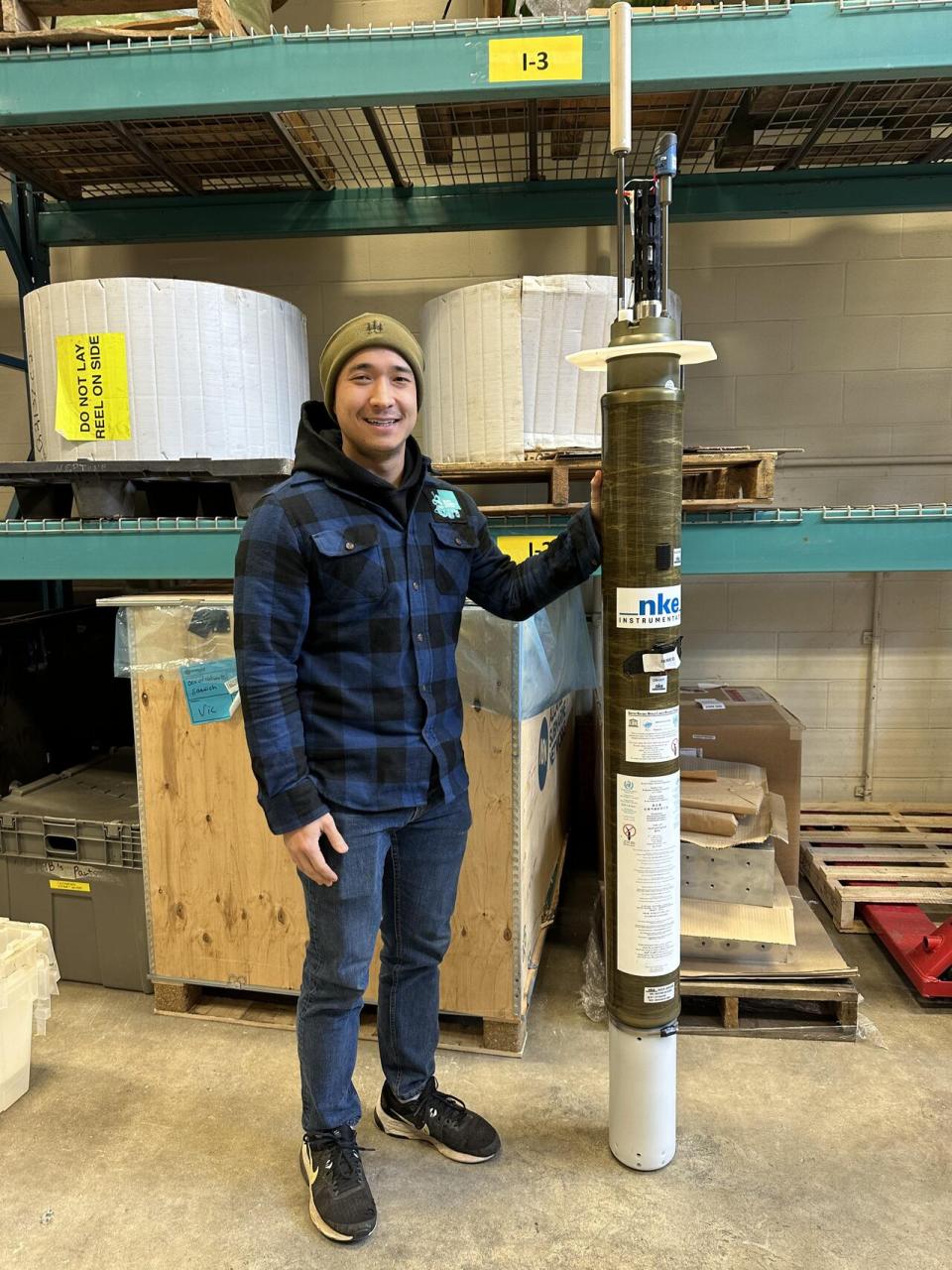 Albert Ruskey, ONC project engineer EIT, with a Argo Float, deep-sea droids that collect vital ocean data while traveling up and down in the space between the sea surface and the seafloor. 