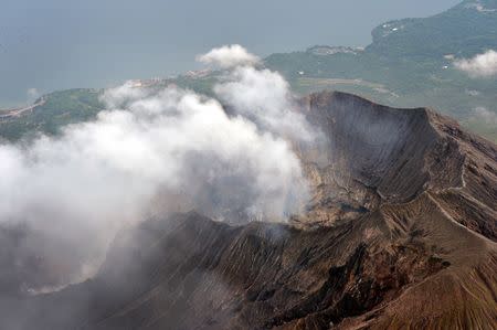 An aerial view shows the crater atop Mt. Sakurajima in Kagoshima, southwestern Japan, in this photo taken by Kyodo August 15, 2015. REUTERS/Kyodo