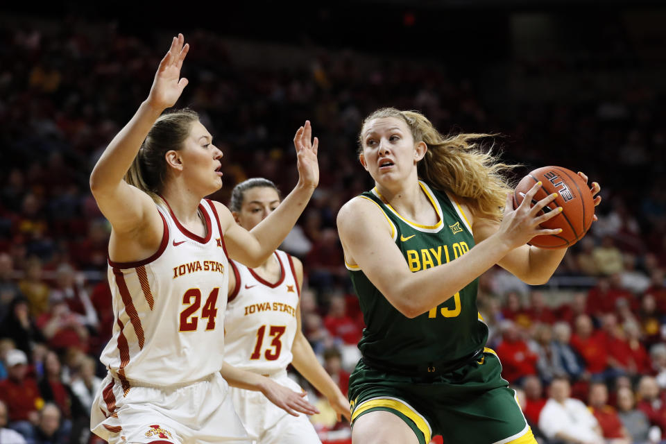 Baylor forward Lauren Cox, right, drives to the basket past Iowa State guard Ashley Joens (24) during the first half of an NCAA college basketball game, Sunday, March 8, 2020, in Ames, Iowa. (AP Photo/Charlie Neibergall)