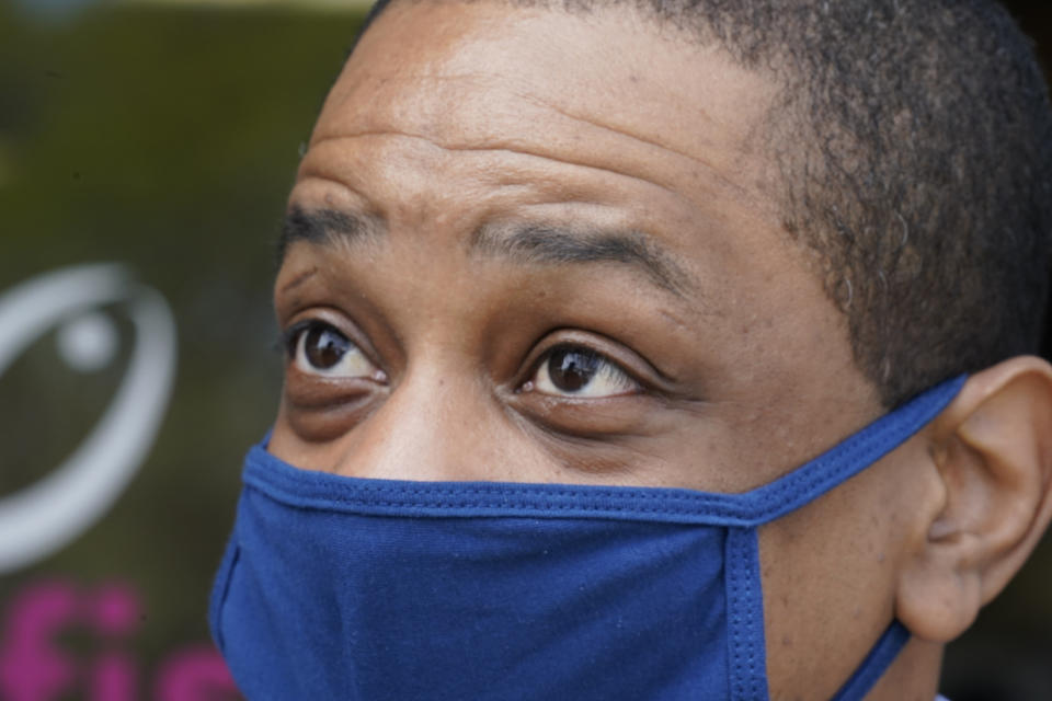 Virginia Democratic gubernatorial candidate Lt. Gov. Justin Fairfax speaks to a supporter outside Pink Fish restaurant in Hampton, Va., Thursday, April 8, 2021. Fairfax has long had lofty political ambitions, and despite facing two unresolved allegations of sexual assault he’s pressing forward with a bid for governor. (AP Photo/Steve Helber)