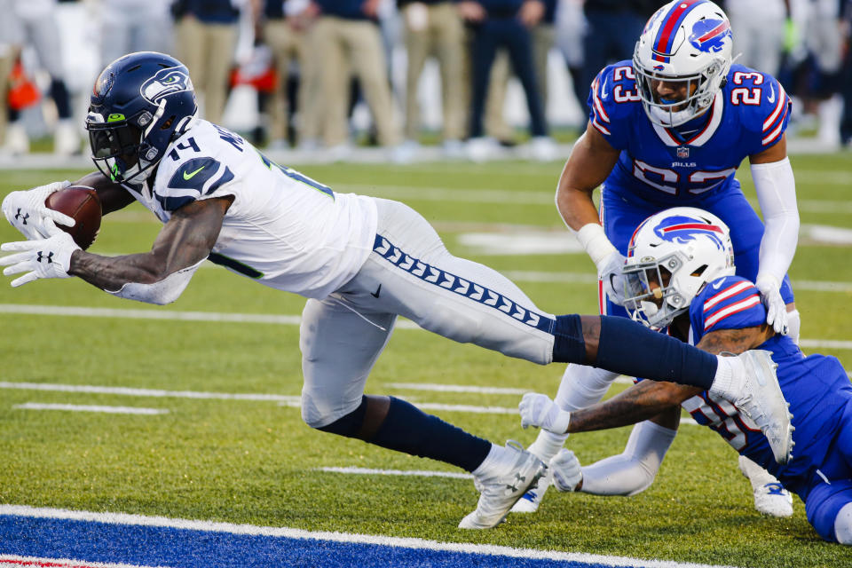 Seattle Seahawks' DK Metcalf (14) dives for a touchdown as Buffalo Bills' Dane Jackson (30) attempts to tackle him during the second half of an NFL football game Sunday, Nov. 8, 2020, in Orchard Park, N.Y. (AP Photo/Jeffrey T. Barnes)