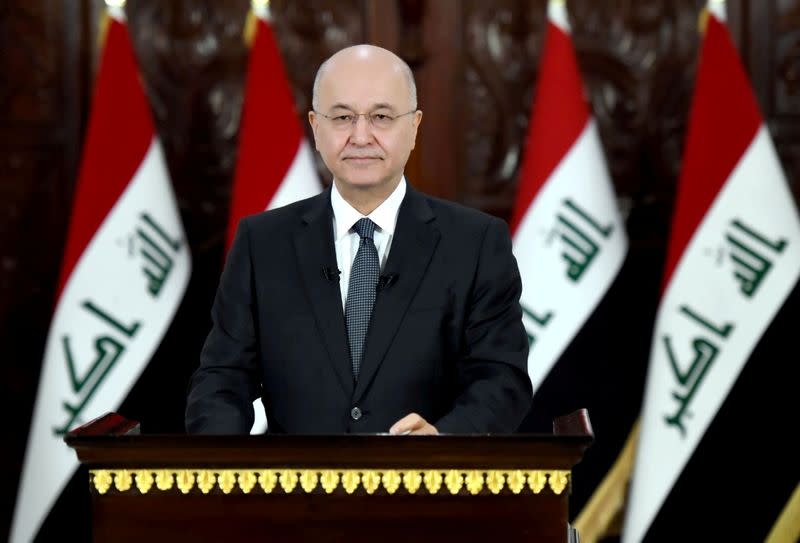 Iraq's President Barham Salih delivers a televised speech to people in Baghdad