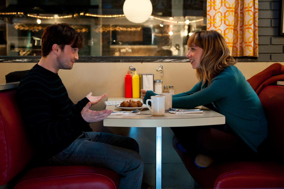 Daniel Radcliffe and Zoe Kazan sitting in a diner booth in What If